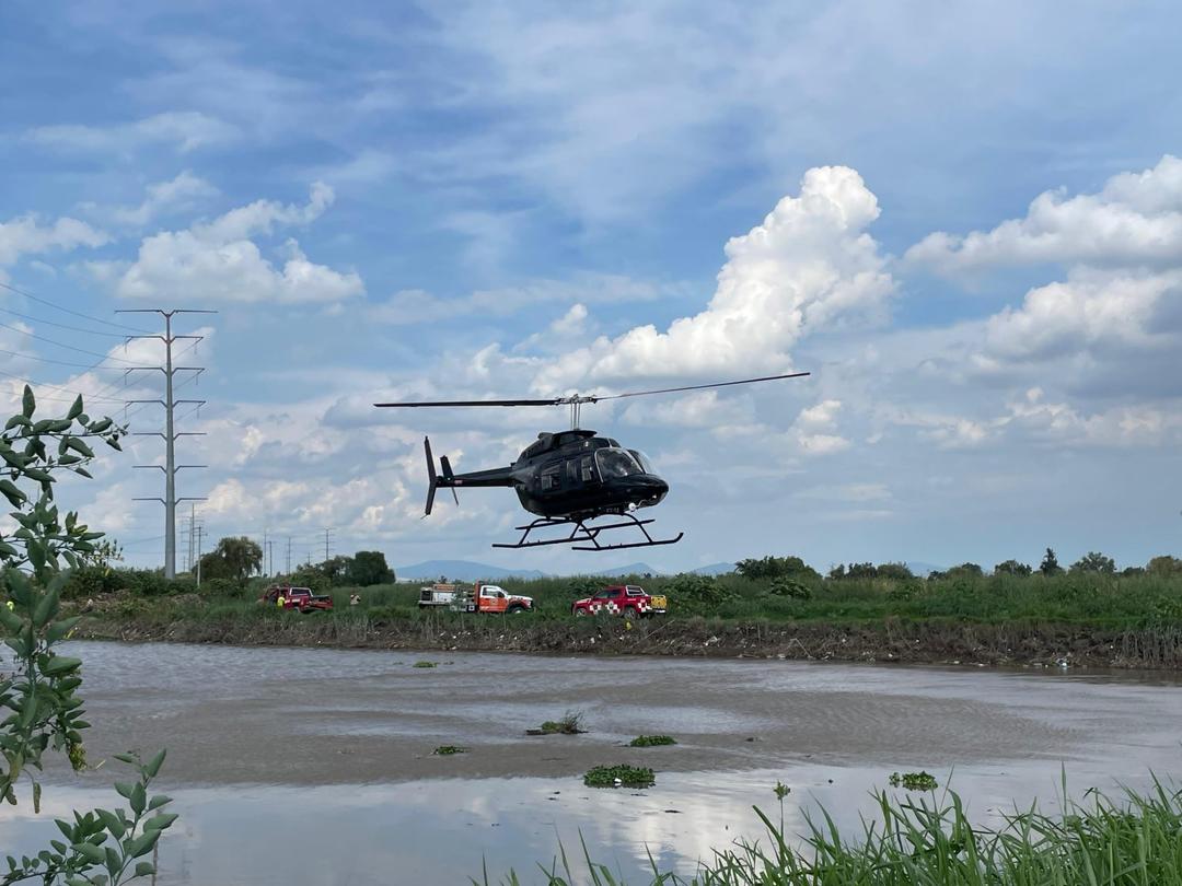 Tlajomulco: Continúa la búsqueda de dos personas que fueron arrastradas por la corriente en la presa El Guayabo